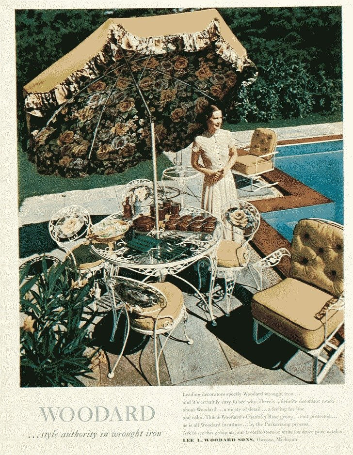 Woodard wrought iron under a garden umbrella