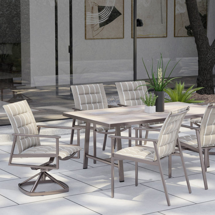 O.W. Lee Marin padded sling dining chairs around a long rectangular dining table