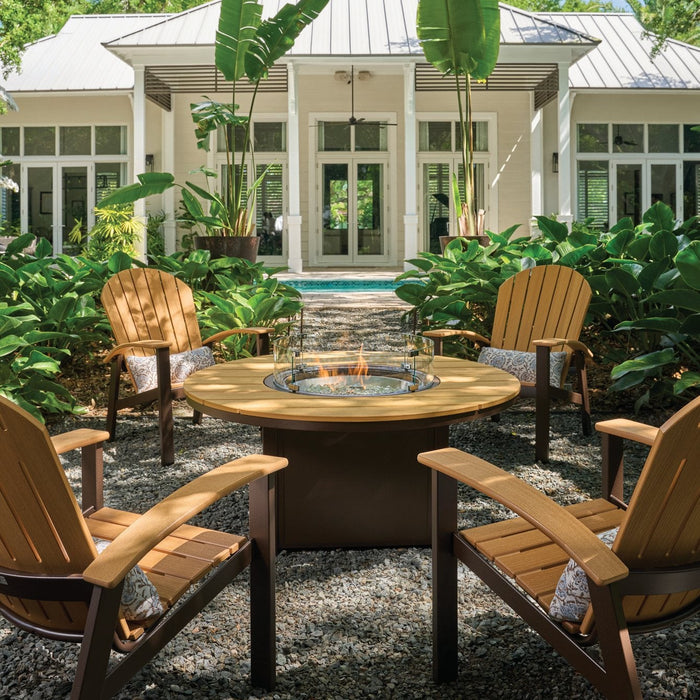 Telescope Casual Newport Adirondack chairs around a round Rustic Polymer fire table