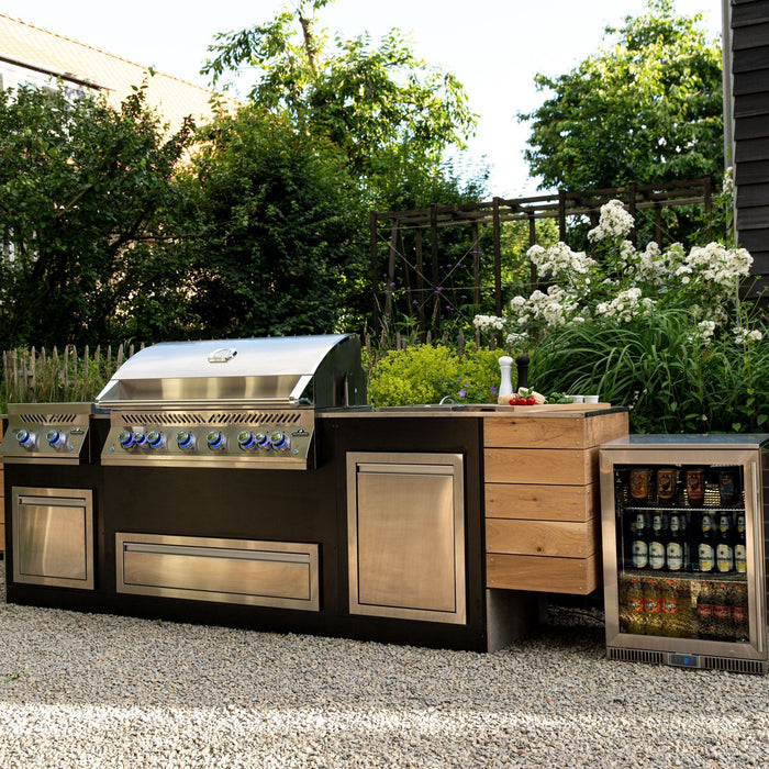 Napoleon Built-In 700 Series grill in a garden outdoor kitchen island