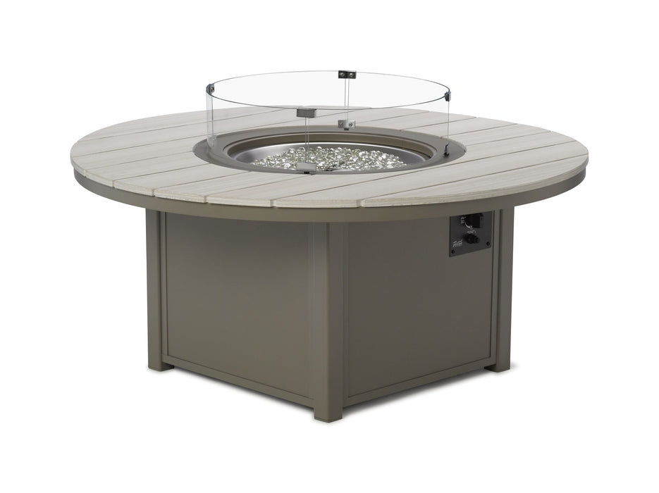 Telescope Casual round MGP slat top fire table shown with the optional 26 inch round tempered glass surround