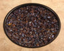 OW Lee Coffee Crushed fire media in a fire pit burner