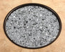 OW Lee Silver Mirrored fire media in a fire pit burner