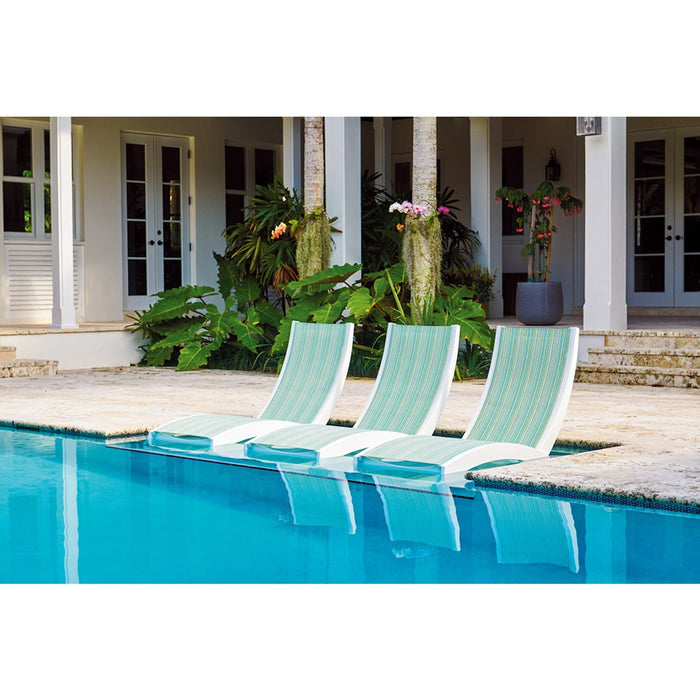 Three Telescope Casual Dune Hydro-Lounge chaises in a pool