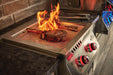 Steaks searing over the infrared SIZZLE ZONE