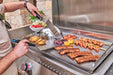 Cooking fish, vegetables and shrimp on the built-in griddle