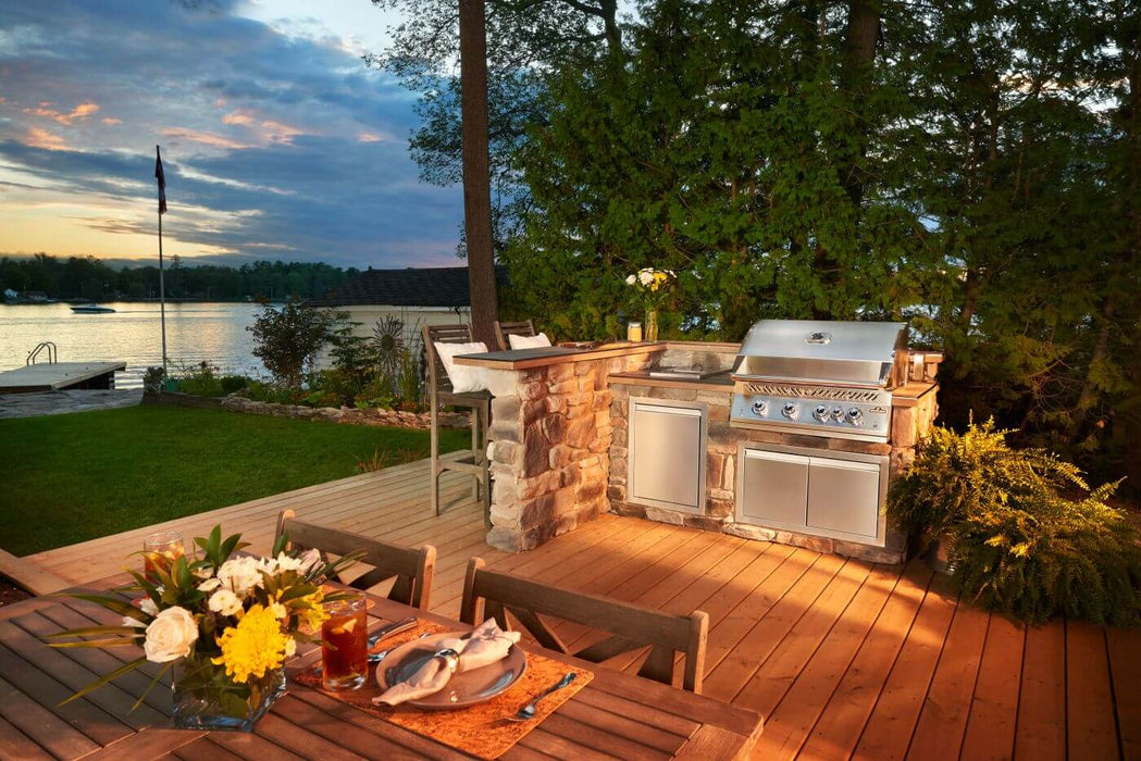 Built-In 700 Series 32 in a lakeside outdoor kitchen at sunset