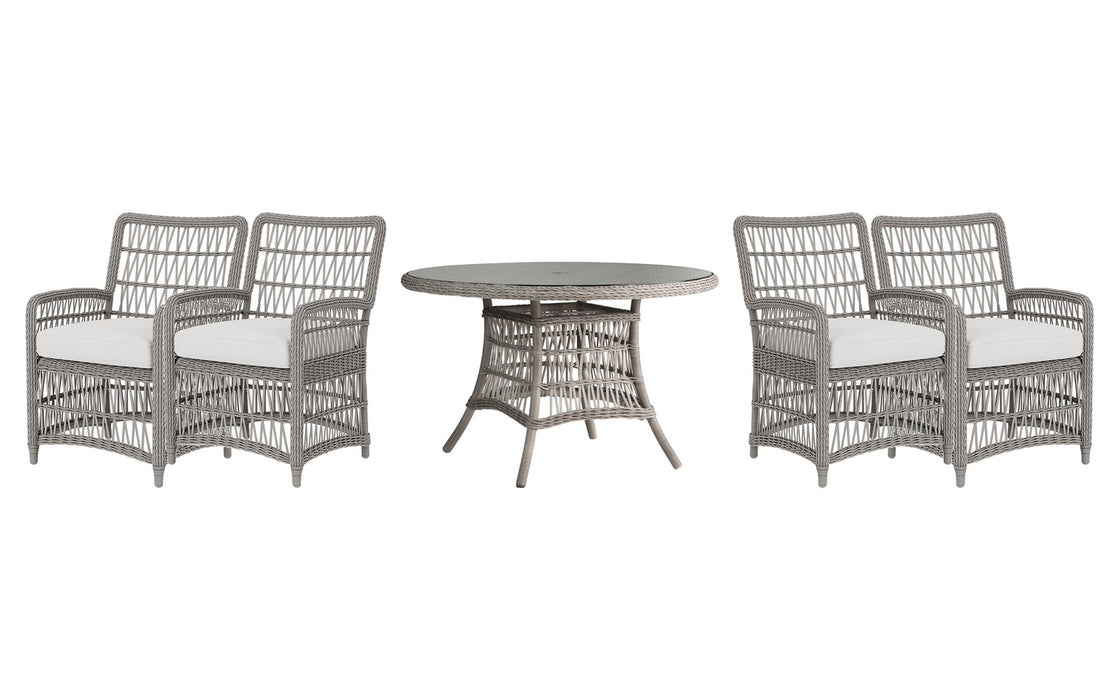 Lloyd Flanders Mackinac dining set on a patio, with each included piece