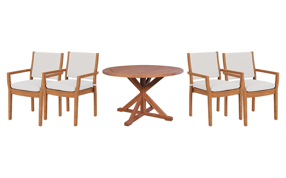Lloyd Flanders Teak dining set on a patio, with each included piece