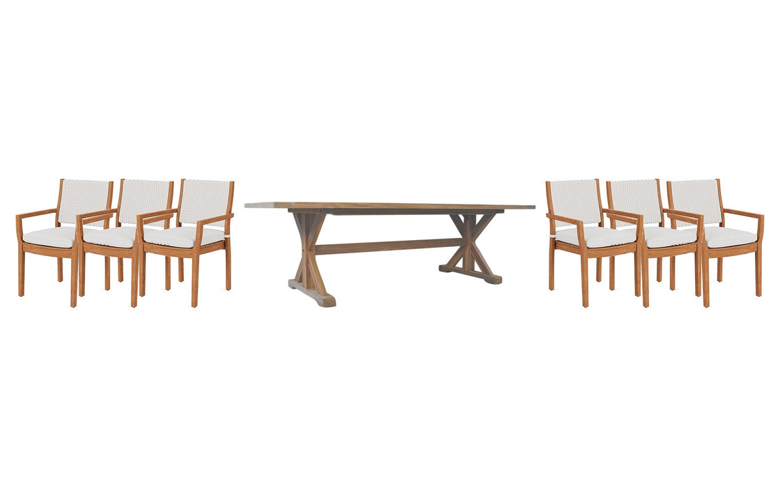 Lloyd Flanders Teak dining set on a patio, with each included piece