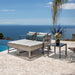 OW Lee Studio Lounge Chair & Ottoman Set on a patio, with each included piece