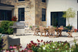 Prestige 665 Connected on a stone patio set for dinner