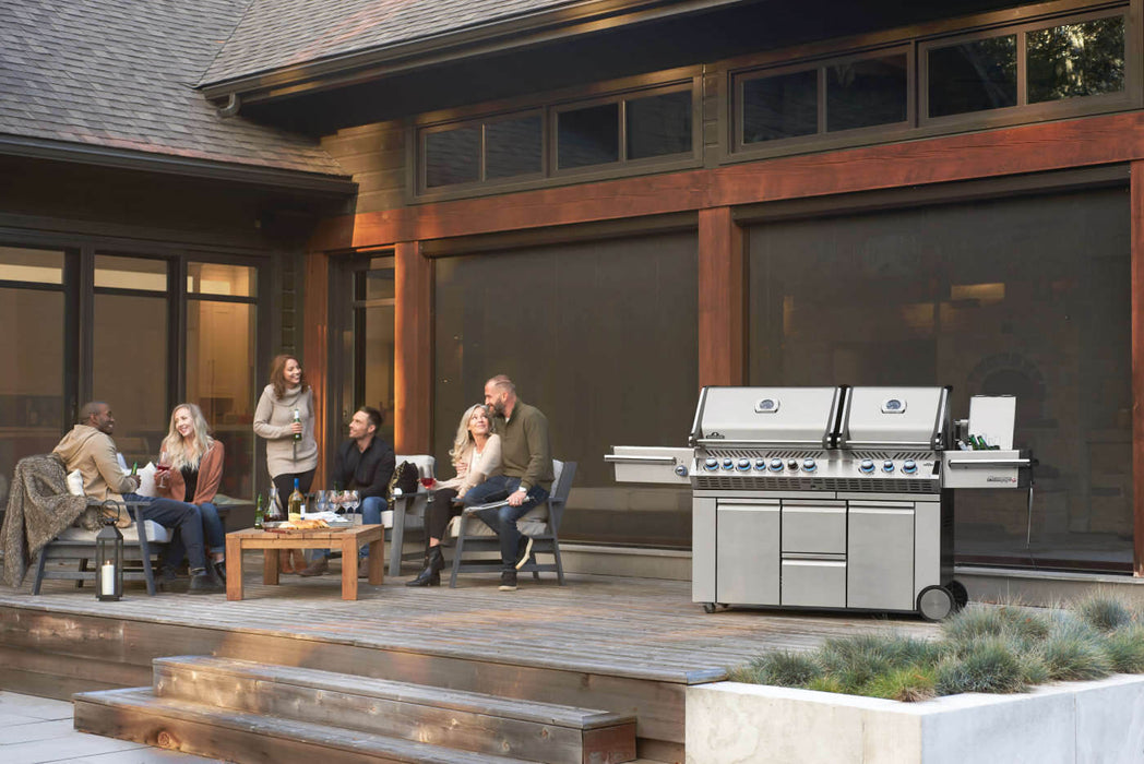 Prestige PRO 825 on a patio with friends at dusk