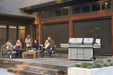 Prestige PRO 825 on a patio with friends at dusk