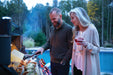 Couple grilling on the Prestige PRO 825 at dusk