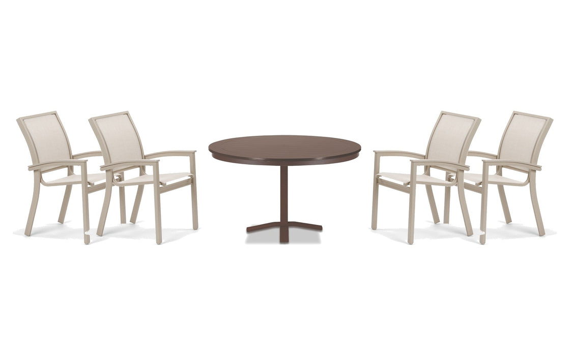 Telescope Casual Bazza dining set on a patio, with each included piece