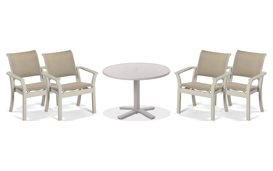 Telescope Casual Dune dining set on a patio, with each included piece