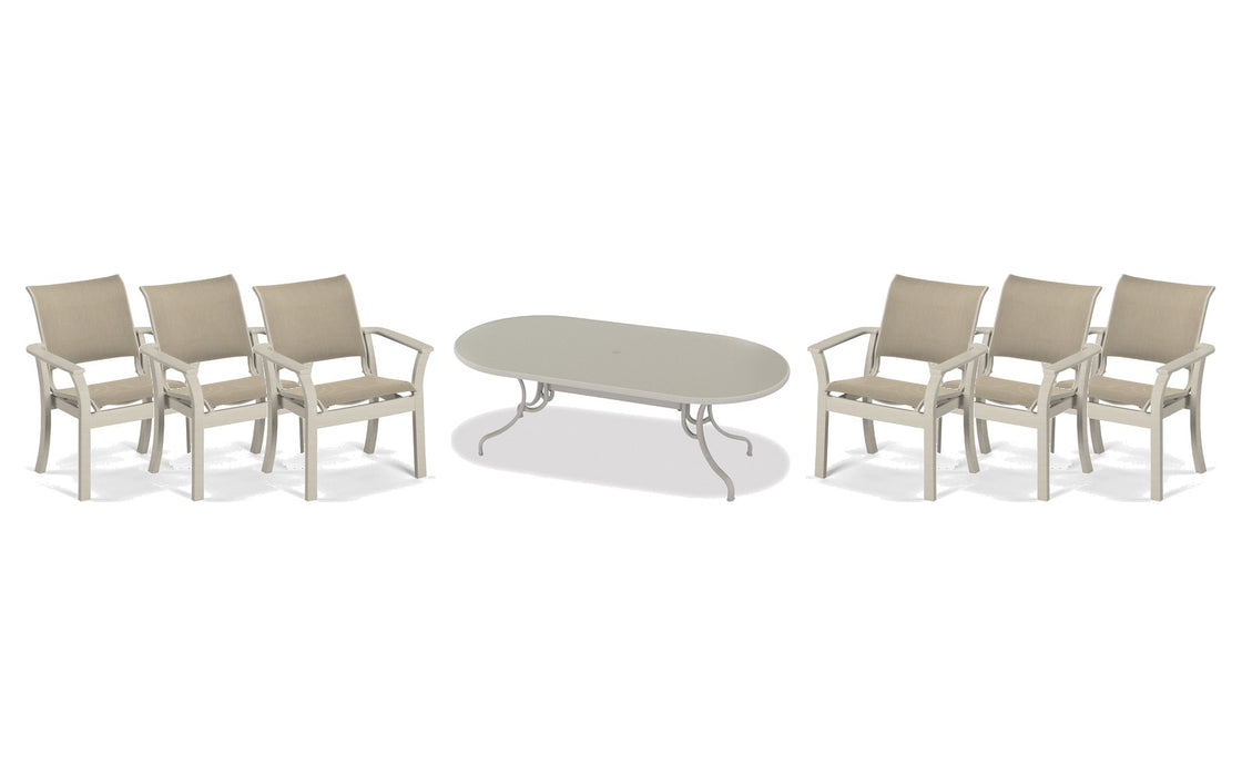 Telescope Casual Dune dining set on a patio, with each included piece