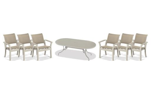Telescope Casual Dune dining set on a patio, with each included piece