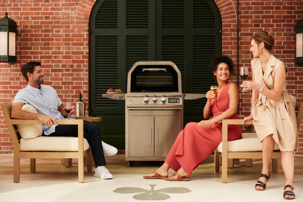 Blaze LTE+ 26" outdoor pizza oven, guests relaxing on the patio