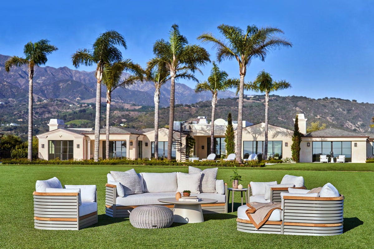 Brown Jordan Solenne lounge seating on a lawn with palm trees