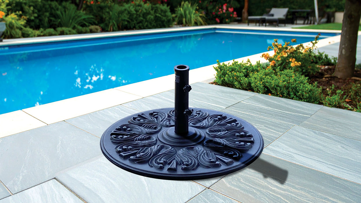 Galtech black cast iron umbrella base beside a pool