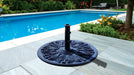 Galtech black cast iron umbrella base beside a pool