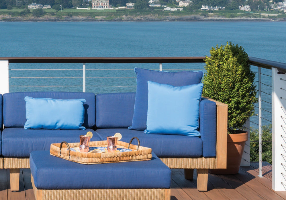 Lloyd Flanders square and lumbar throw pillows on a Catalina sectional by the water