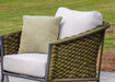 Lloyd Flanders throw pillow in soft green on an Escape lounge chair