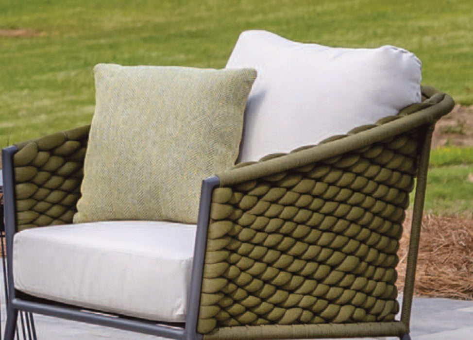 Lloyd Flanders throw pillow in soft green on an Escape lounge chair