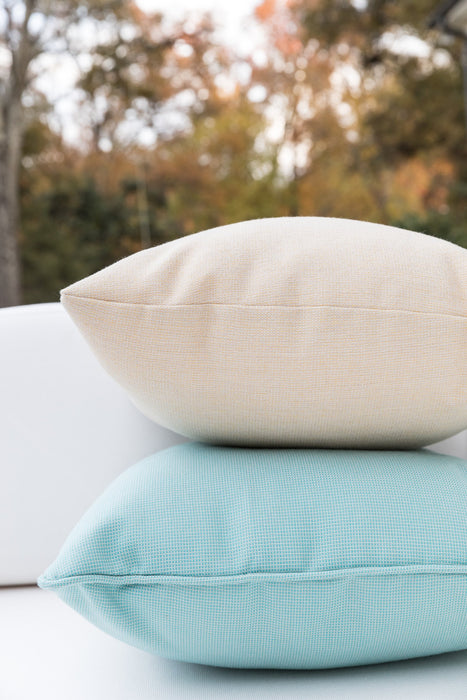 Stacked Lloyd Flanders square throw pillows in cream and aqua