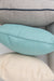 Lloyd Flanders throw pillows stacked, gray with navy welt over aqua and cream