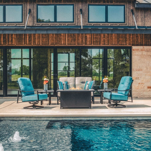 OW Lee Avana 3-Piece Conversation Set by a pool with a fire table