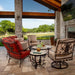 OW Lee San Cristobal curved sectional, lounge chair and swivel rocker by an outdoor fireplace