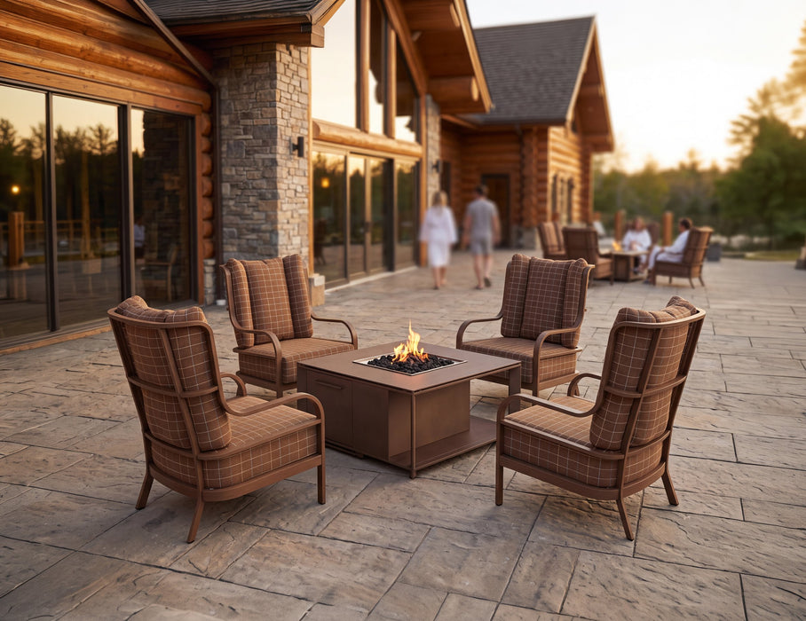 Woodard Brit 4-Piece Lounge Chair Set, shown in a Woodard outdoor setting (the fire table shown is not included)