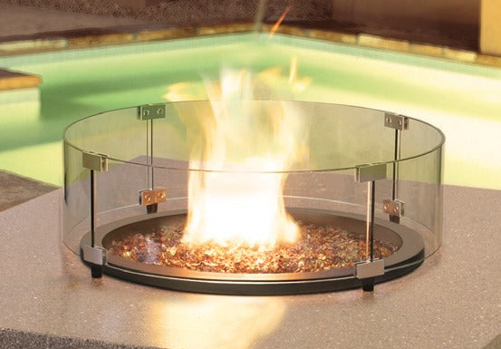 Homecrest 22.5" round glass guard in use on a fire table