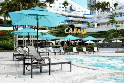 Homecrest Blair sling chaise lounges by a resort pool