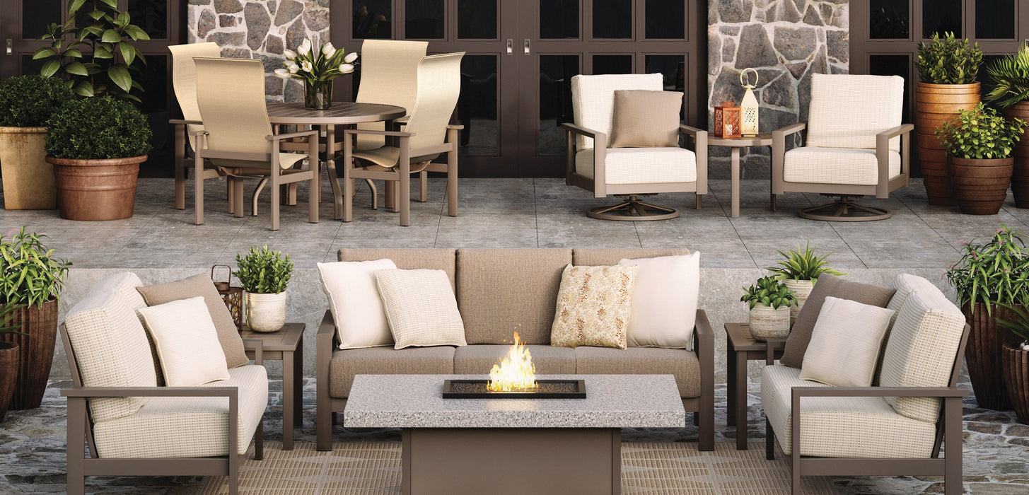 Homecrest Stonegate rectangular fire table with a sofa set