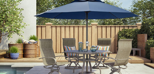 Homecrest Shadow Rock round dining table with an umbrella