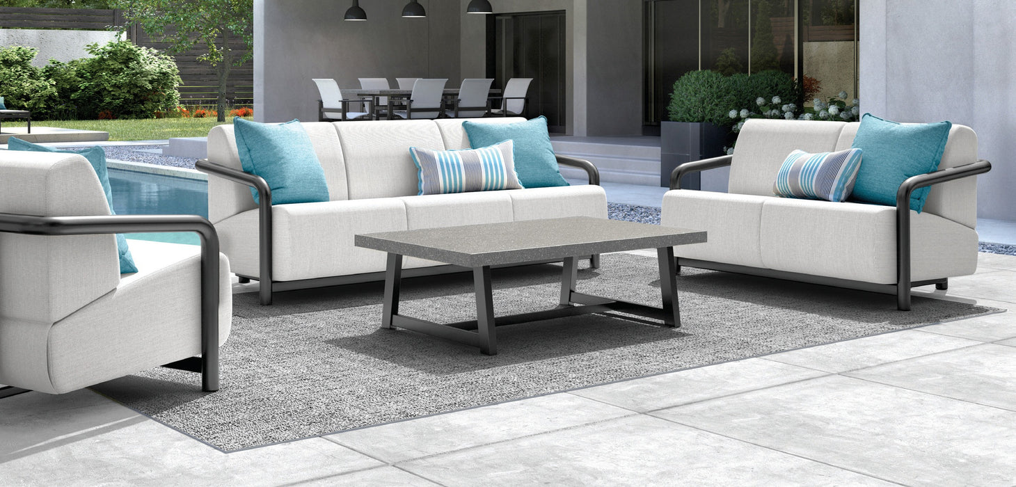 Homecrest Luxury Woven Vinyl outdoor rug under a seating group