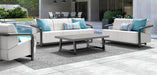 Homecrest Luxury Woven Vinyl outdoor rug under a seating group