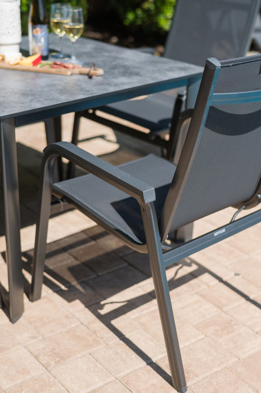 Kettler Basic Plus Stack Chair at a dining table (table not included)
