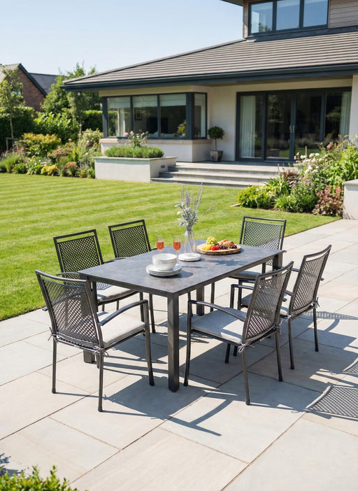 Kettler Reno 7-Piece Dining Set with Umbrella Hole on a garden patio (seat pads shown not included)