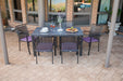 Kettler Reno 7-Piece Dining Set with Umbrella Hole on a brick patio (seat pads shown not included)