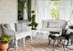 Lloyd Flanders All Seasons settee and settee swing in Ivory on a porch