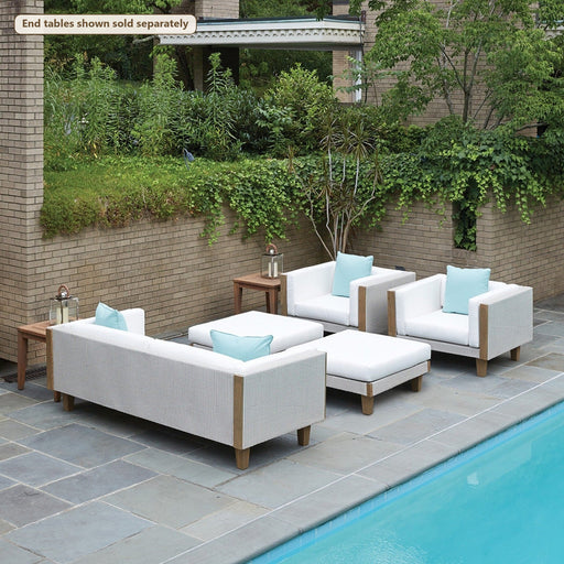 Lloyd Flanders Catalina 5-Piece Lounge Set with Ottomans on a patio (End tables shown sold separately)
