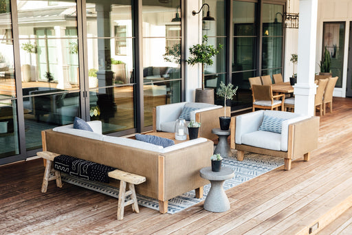 Lloyd Flanders Catalina sofa and lounge chairs in Hickory on a covered deck
