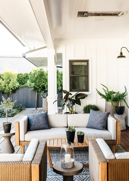 Lloyd Flanders Catalina sofa and lounge chairs on a covered porch