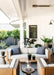Lloyd Flanders Catalina sofa and lounge chairs on a covered porch