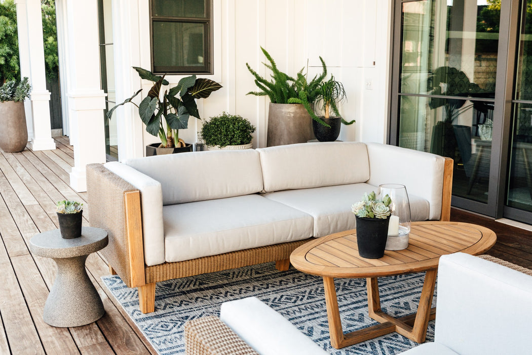 Lloyd Flanders Catalina sofa in Hickory on a covered porch